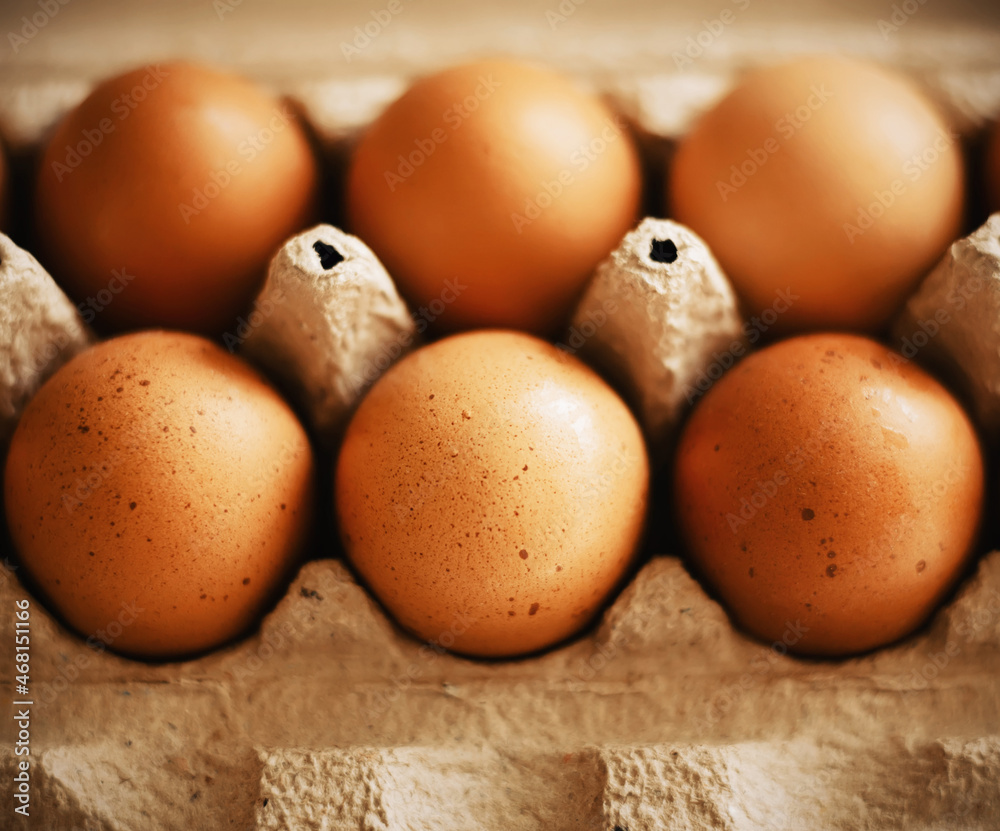 Chicken brown eggs are in a cardboard box bought at a grocery store. Healthy breakfast. Proper nutrition. Chicken brown eggs are in a cardboard box bought at a grocery store. Healthy breakfast. Proper nutrition.