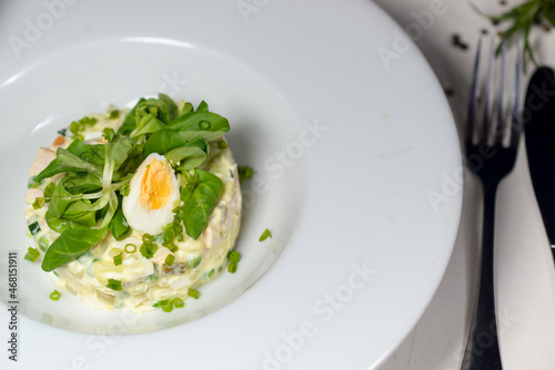 Olivier salad with microgin and quail egg
