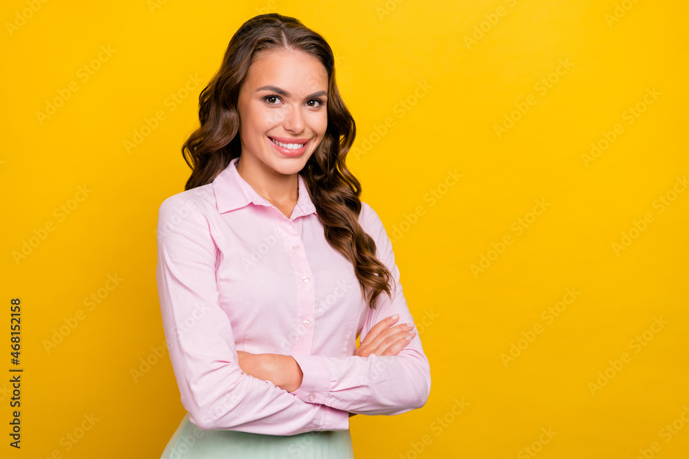 Photo of bossy young brunette lady crossed arms wear pink shirt isolated on yellow color background Photo of bossy young brunette lady crossed arms wear pink shirt isolated on yellow color background