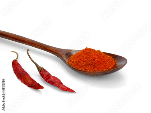 Chili powder and dried chilli in spoon on white background, cayenne pepper.