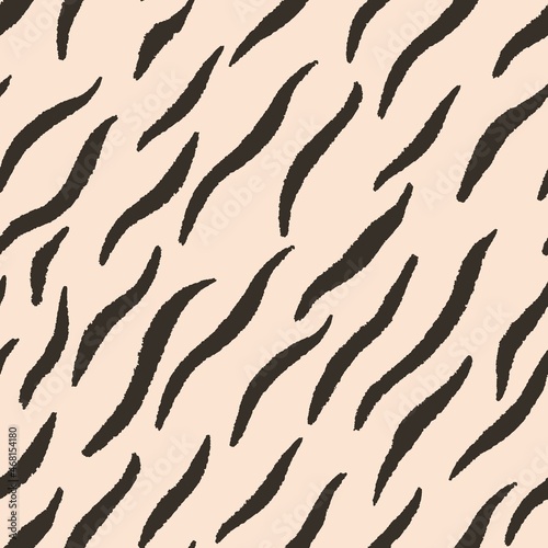 Seamless striped tiger pattern, vector illustration. Background with imitation of the skin of a Bengal tiger. Template for backing, fabric, wallpaper and packaging.
