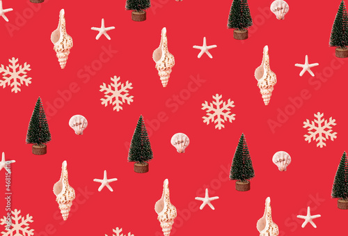 Seashells  snowflake and Chistmas tree on red background. Minimal xmas or new year sea pattern.