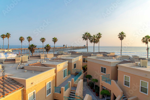 View of roof decks of complex buildings with beach waterfront at Oceanside  California