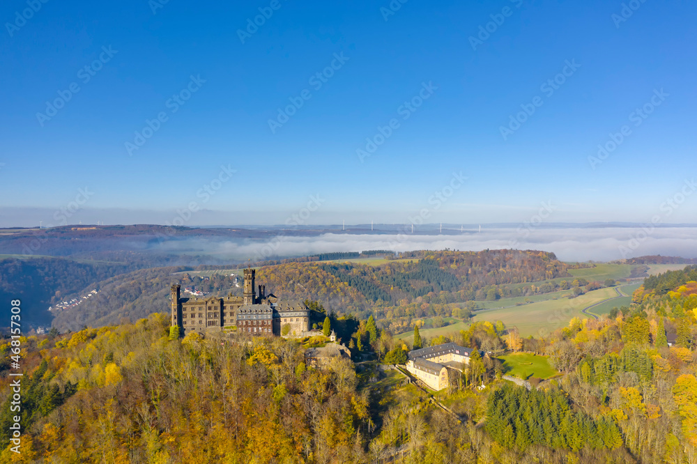 Bird's eye view of the magnificent Schaumburg Castle near Balduinstein / Germany on the Lahn in autumn 