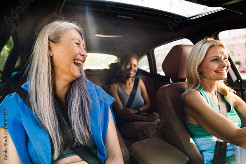 Multiracial women laughing and talking in car after practice © Drobot Dean