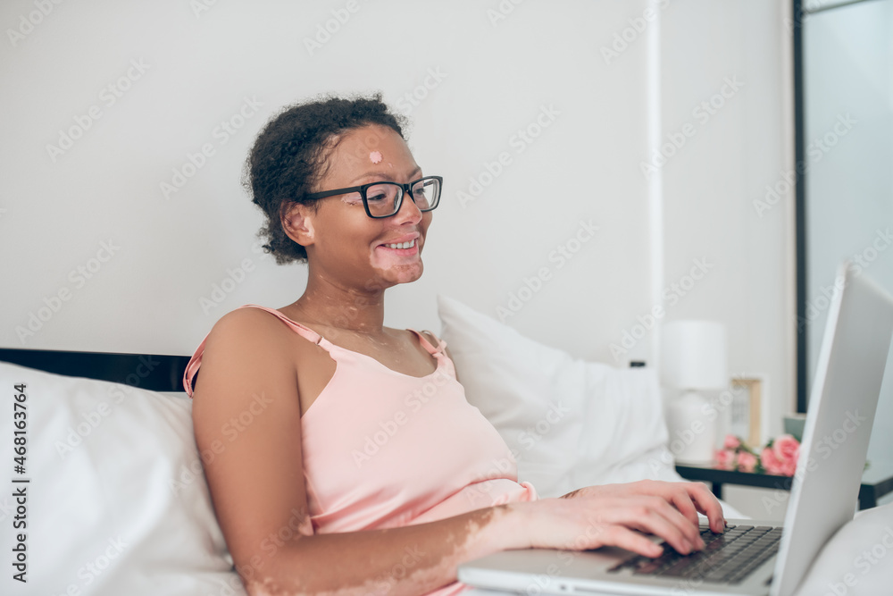 A pretty young woman in eyeglasses looking thoughtful A pretty young woman in eyeglasses looking thoughtful
