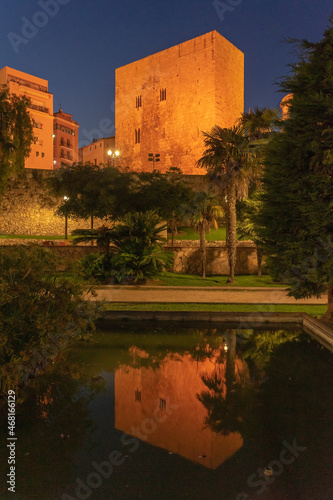 Pretori romanesque tower in the old town of the city of Tarragona (World Heritage Site by UNESCO) illuminated at night. Cataluña, Spain. photo