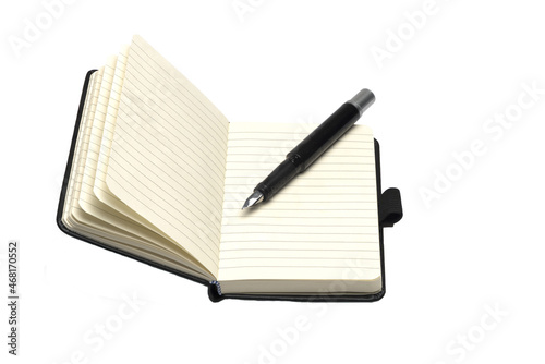 opened leather notebook with pen on white