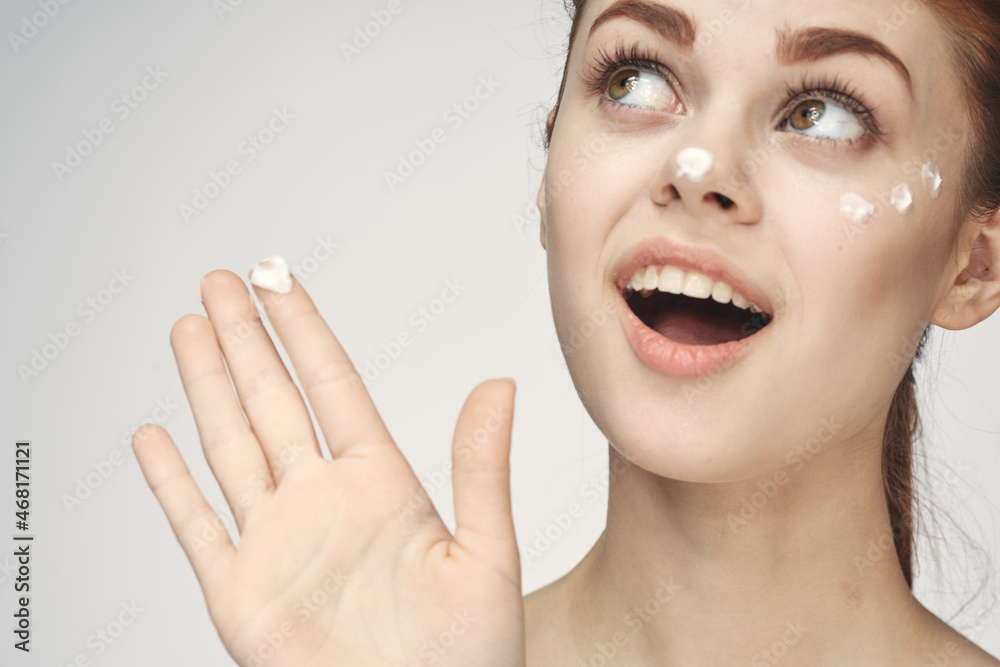 woman with face cream naked shoulders cosmetics face care woman with face cream naked shoulders cosmetics face care
