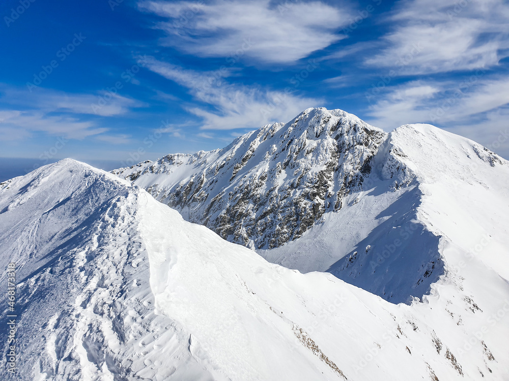 Obraz premium snow covered mountains, Buteanu Peak, Fagaras Mountains, Romania