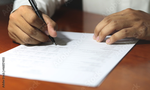 Businessman signing important document