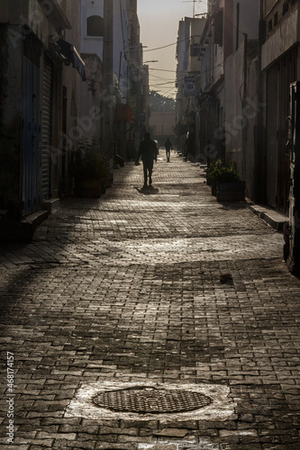 person alone in old city street