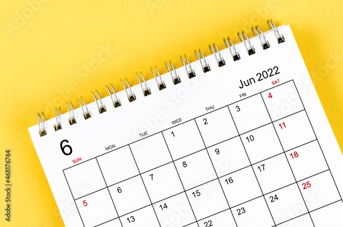 June 2022 desk calendar on yellow background. © gamjai