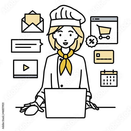 デスクで座ってPCでネットショップやマーケティングの仕事をしている調理師の女性