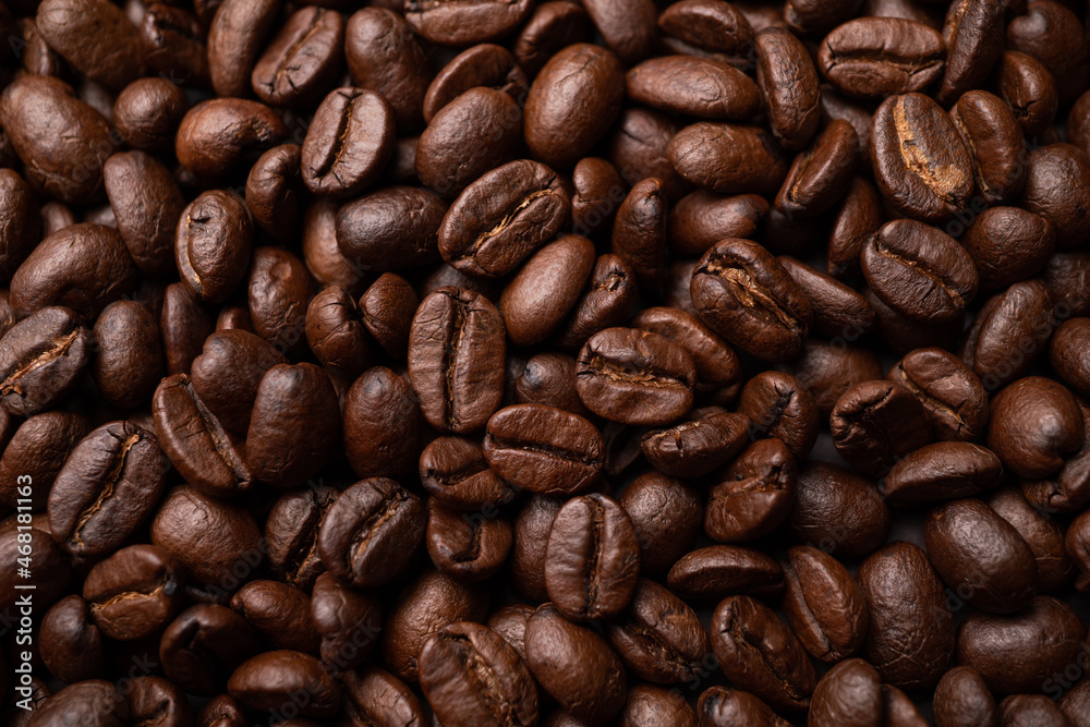 Close up of group black coffee beans. Strong black espresso, Grounds of coffee background, texture