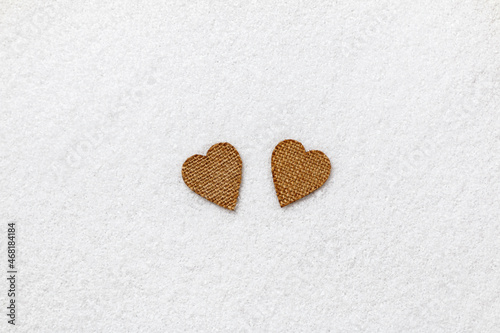 Valentine s day concept. Two hearts in the snow.