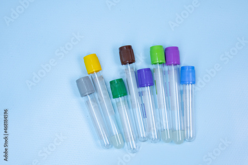 Vacuum tubes for collection and blood samples with sodium citrate EDTA heparin fluoride anticoagulant for laboratory on blue background