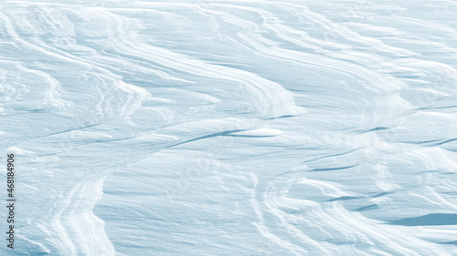 Snowy abstract background. Natural patterns in the snow.