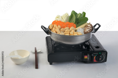 Black portable tourist gas stove with sukiyaki pot photo