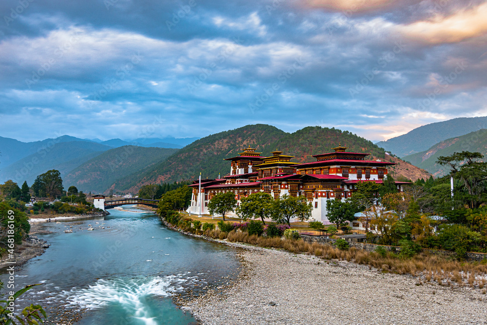 Naklejka premium Punakha Dzong/Monastery is situated in Punakha, Bhutan, and acts as the principal administrative center of the region. It is also one of Bhutan's oldest & grandest Dzongs.