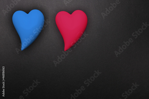 two hearts red and blue on a black background, a symbol of love, the basis for the designer, wallpaper, gift wrapping, valentine's day background
