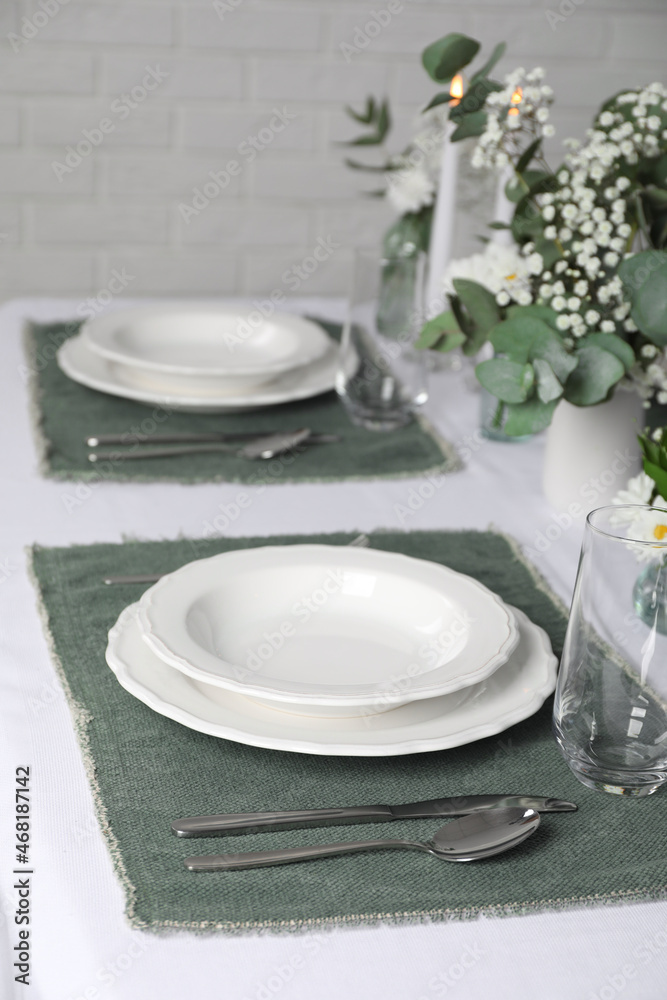 Elegant festive setting with floral decor on table