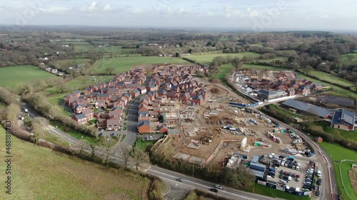 A short full HD aerial video of housing construction on a greenfield site at the edge of the town