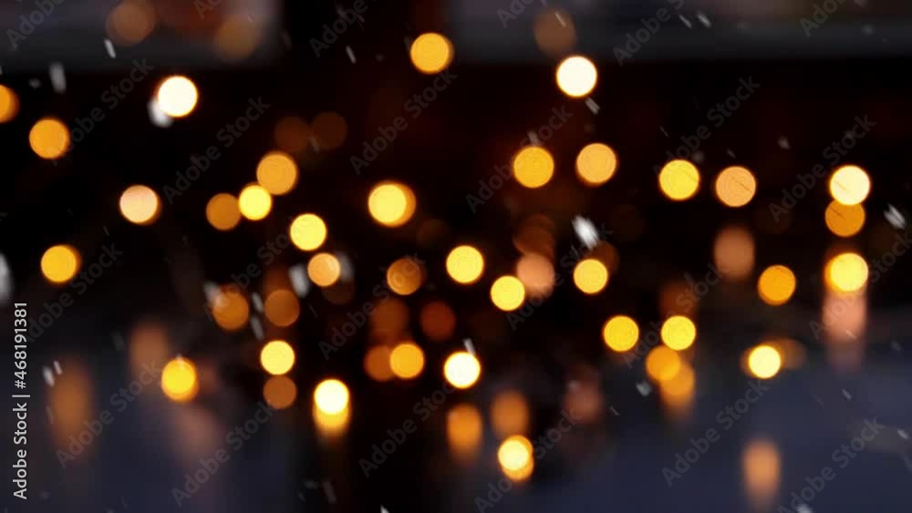 holidays and celebration concept - blurred christmas lights on window sill over snow