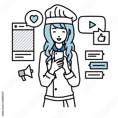 立ってスマートフォンでさまざまなSNSで楽しく交流する調理師の女性