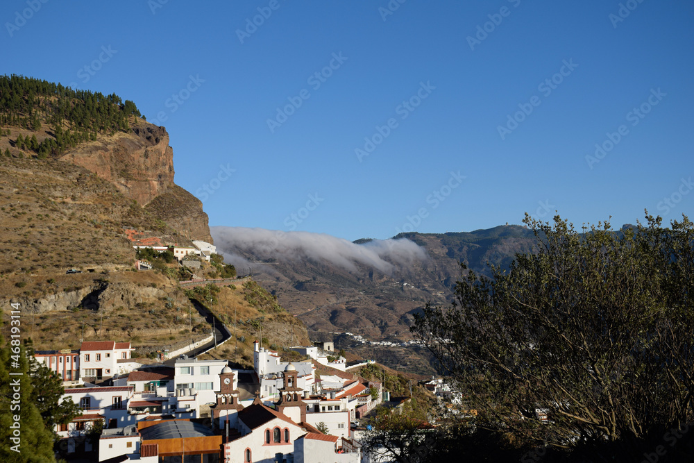 landscape of the town of artenara between mountains and clouds. sky,nature