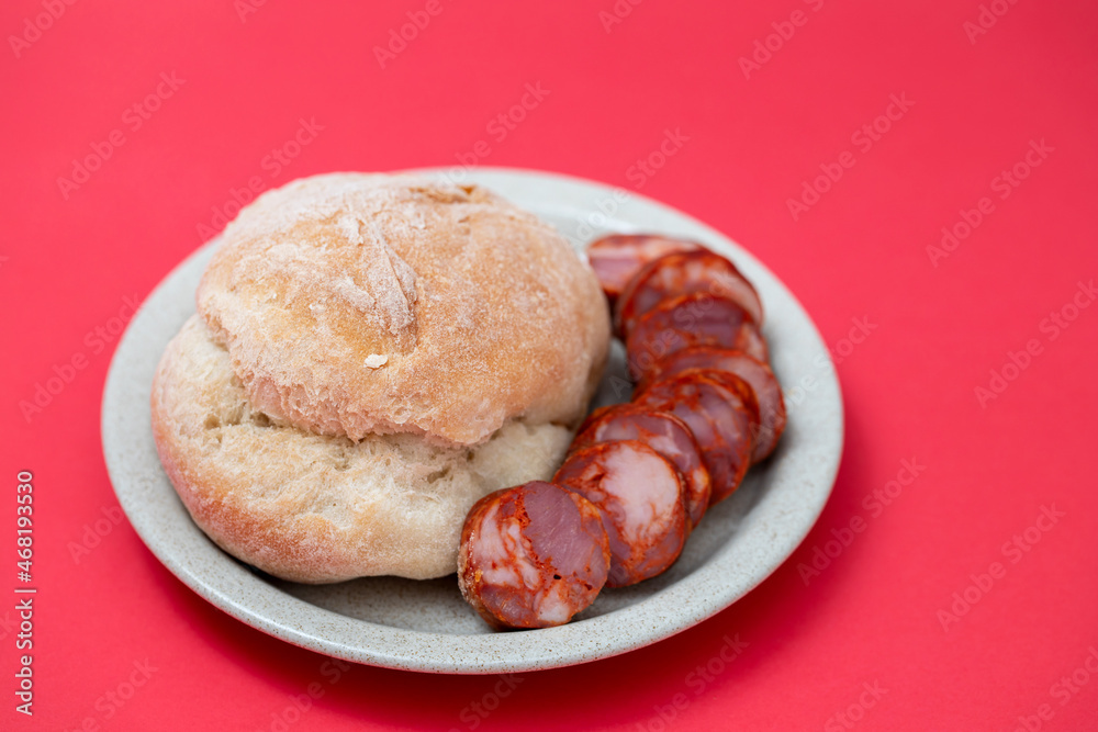 Fototapeta premium fresh bread in small backet on blue background