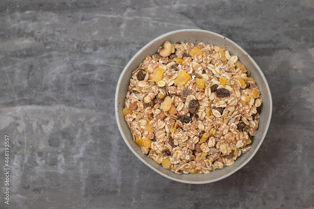 dry muesli with dry fruits in small bowl dry muesli with dry fruits in small bowl