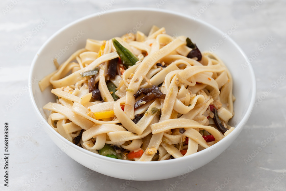 boiled noodle Udon with vegetables on ceramic bowl