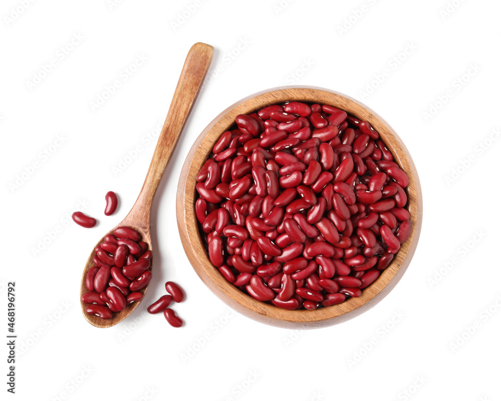 Raw red kidney beans with wooden bowl and spoon isolated on white, top view Raw red kidney beans with wooden bowl and spoon isolated on white, top view