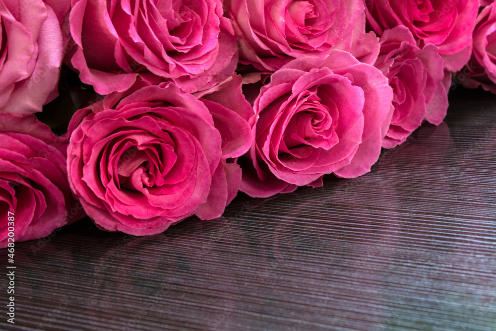 Bouquet of red roses on dark background. Valentine's day concept. Bouquet of red roses on dark background. Valentine's day concept.