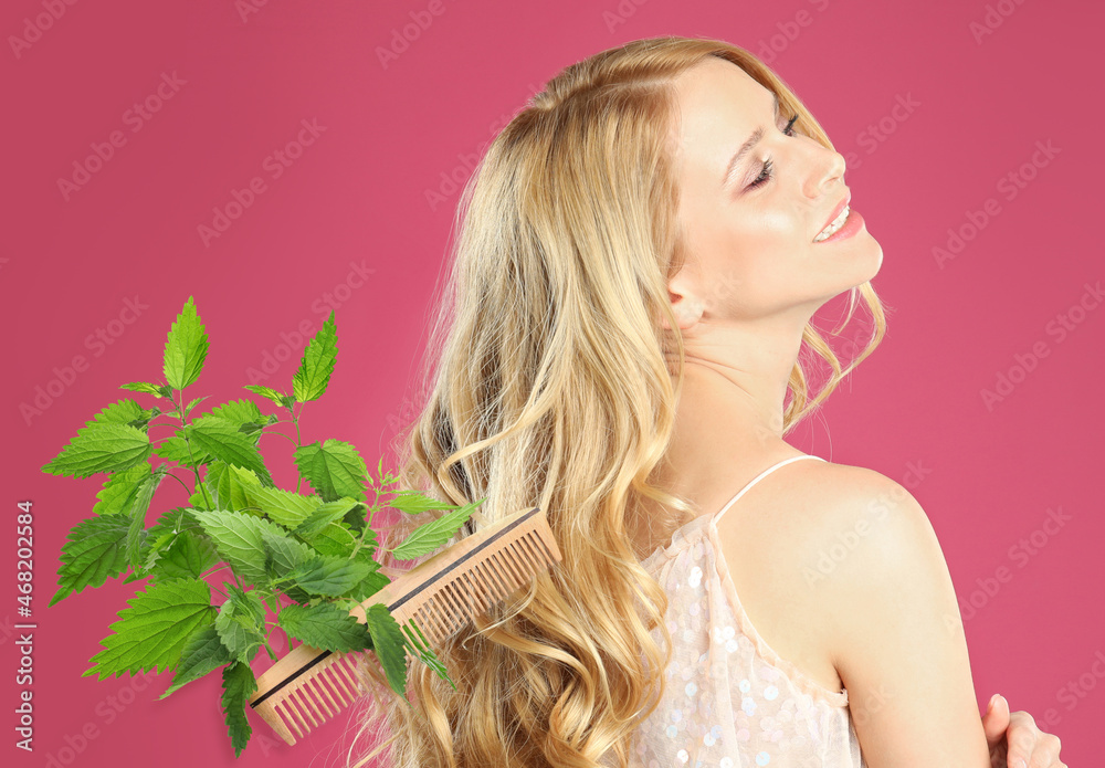 Natural hair care. Beautiful young woman, green stinging nettles and comb on pink background Natural hair care. Beautiful young woman, green stinging nettles and comb on pink background
