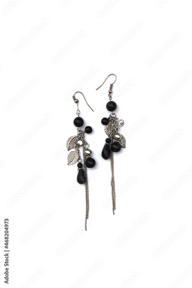 Women`s jewelry long earrings on a white background. Women`s jewelry long earrings on a white background.