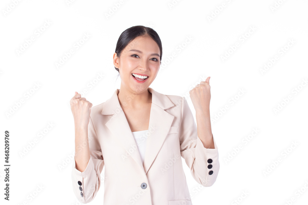 Beautiful young Asian business woman wearing suit feeling successful, good job, happy and smile celebrating with arms up isolated on white background. Beautiful young Asian business woman wearing suit feeling successful, good job, happy and smile celebrating with arms up isolated on white background.