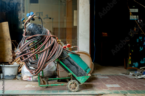 Gas tank for welding and cutting steel, very old condition, placed in a construction site