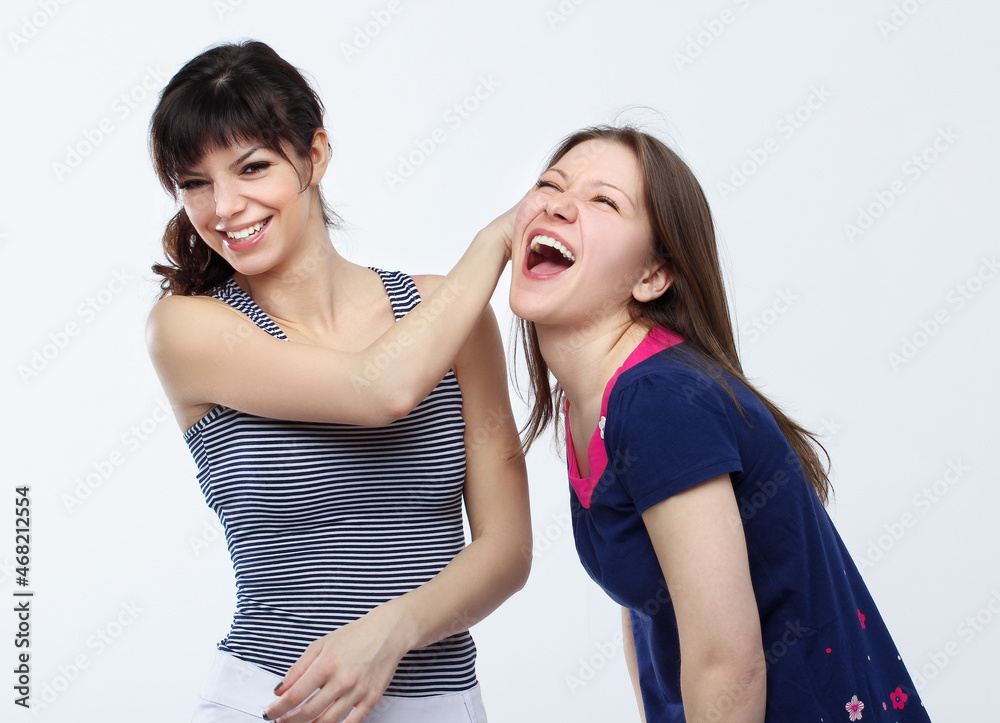 Happy friends hugging each other.Teenage girl using smart phone.Selfie.Girl have fun . Happy friends hugging each other.Teenage girl using smart phone.Selfie.Girl have fun .