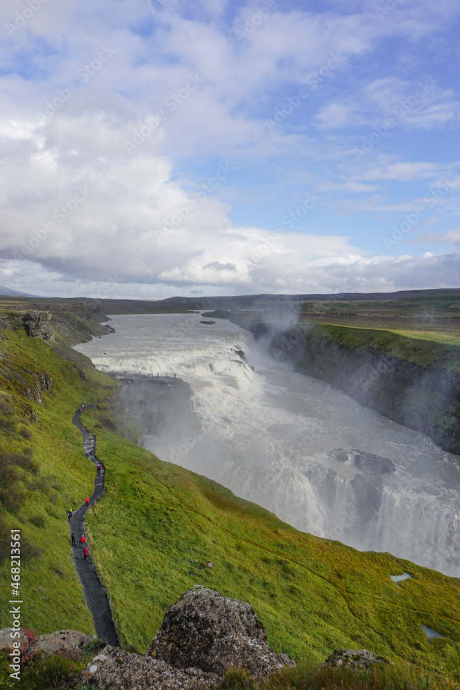 Southwest Iceland: Visitors walk along a trail as mist rises from Gullfoss (Golden Falls), the most famous waterfall in Iceland.