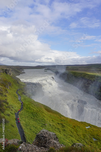 Southwest Iceland: Visitors walk along a trail as mist rises from Gullfoss (Golden Falls), the most famous waterfall in Iceland.