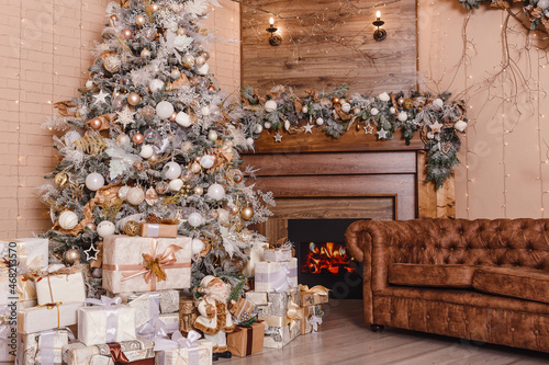Christmas tree and fireplace in the room