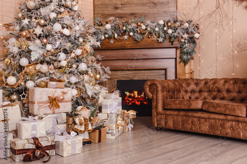 Christmas tree and fireplace in the room