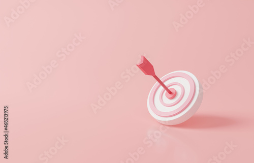 Arrow hit the center of target on pink pastel background. Business finance target concept.3d render success of the arrow bow to the target. Marketing time concept. 3d rendering illustration. Minimal