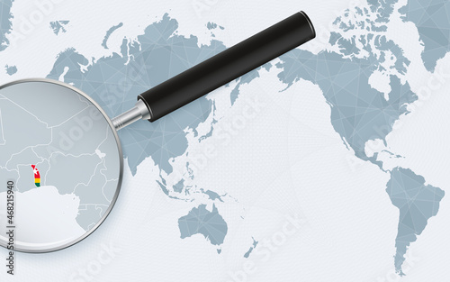 Asia centered world map with magnified glass on Togo. Focus on map of Togo on Pacific-centric World Map.