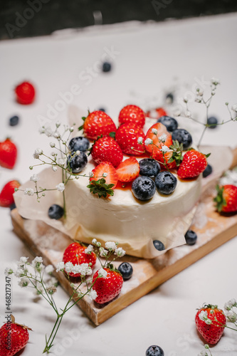 Beautiful strawberry cake decorated with strawberries and blueberries