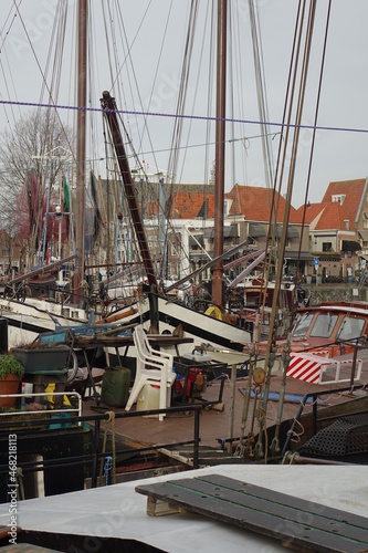 Mix-up of boats in Hoorn Gemeentehaven (municipality harbour) on a cold and gray winter day, Hoorn, North Holland, Netherlands
