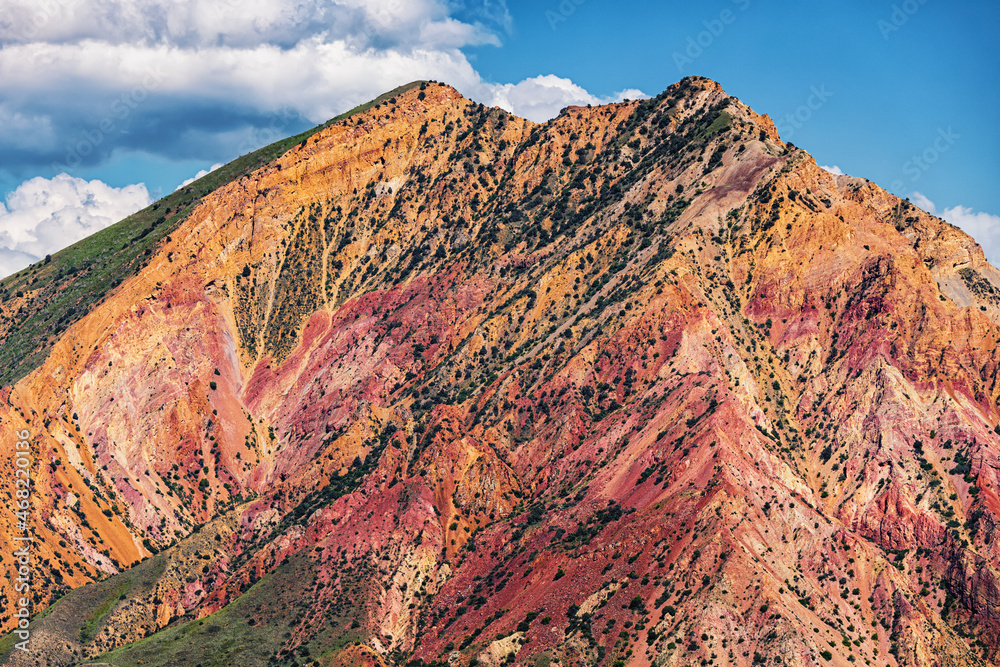 Red rocks with outcrops of geological ferro-magnetic rocks and other minerals in the mountains of Armenia.