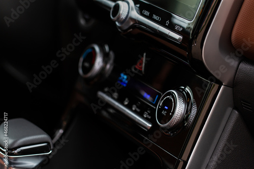 Digital control panel car air conditioner dashboard. Modern car interior conditioning buttons inside a car close up view. Variable focus